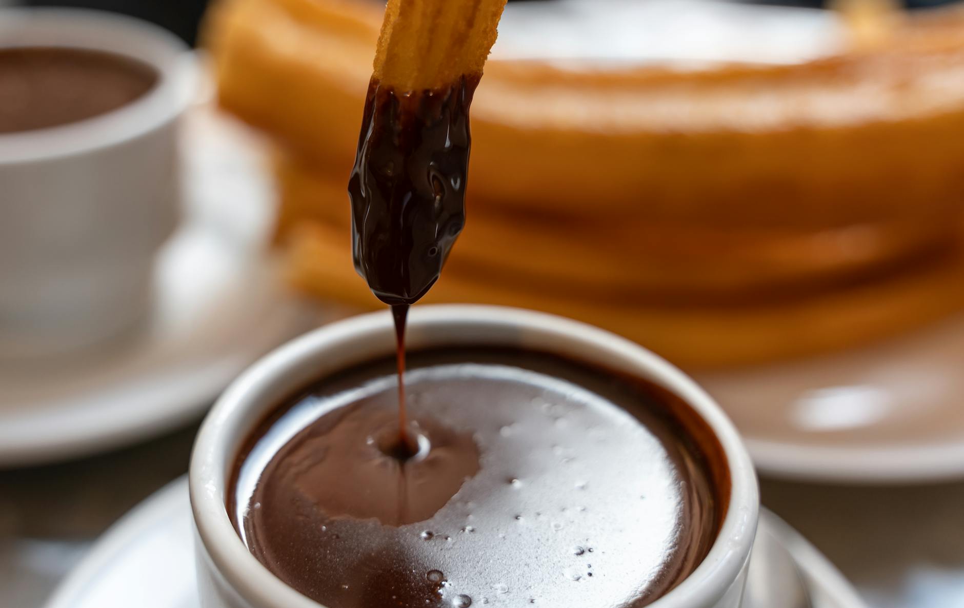 https://www.pexels.com/photo/delicious-churros-with-chocolate-sauce-dip-29398682/
