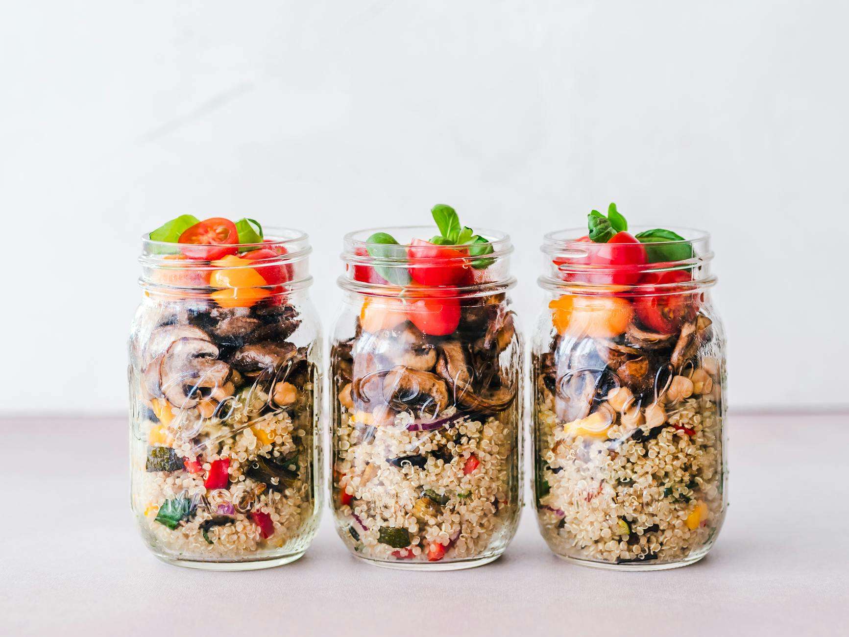 three-clear-glass-jars-on-gray-surface
