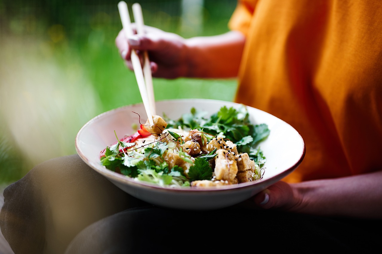 a person eating salad