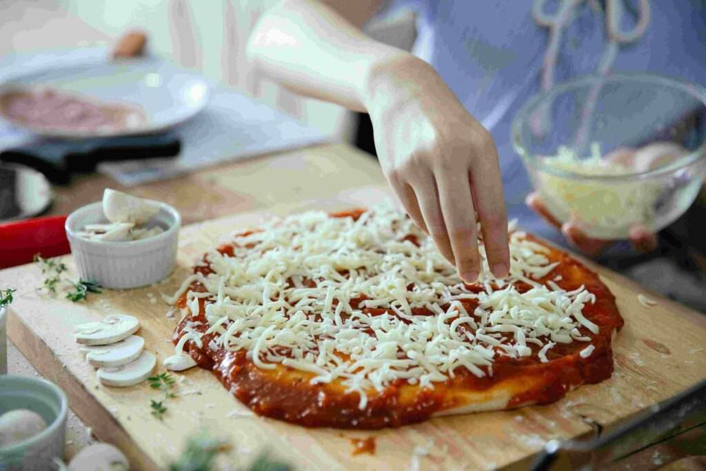 a person Preparing the Perfect Pizza